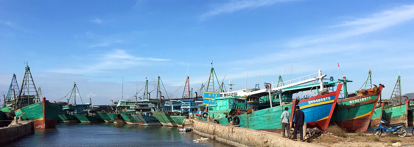 Wooden Fishing Boats Group Stand in a Sea Port